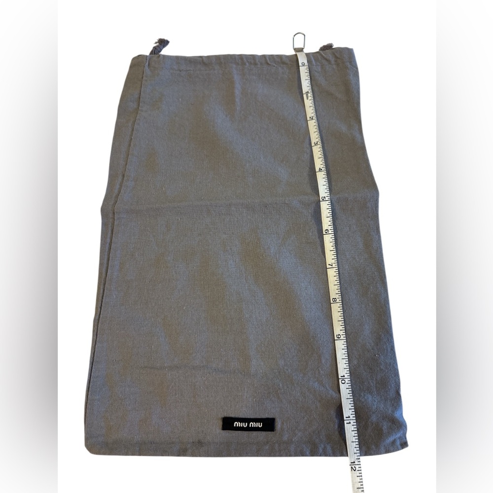 Miu Miu Designer Dust Bag - Grey.
Approximately 12x7”